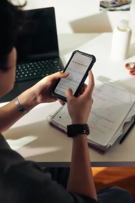 A candidate reviewing a resume on a phone